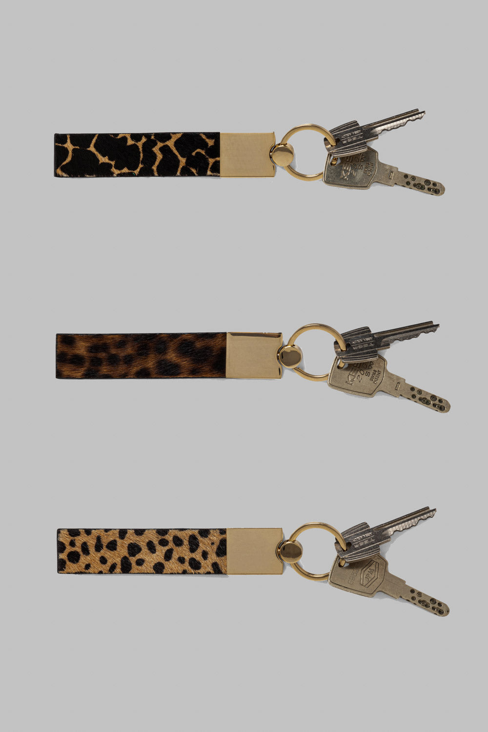The Minis - Porte-clé Tirette en cuir imprimé léopard